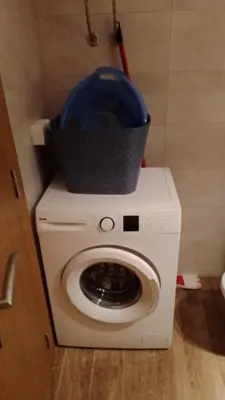 a washing machine with a basket on top of it at Apartman Sky view - Sokobanja in Soko Banja