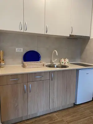 a kitchen with a sink and a counter top at Apartman Sky view - Sokobanja in Soko Banja