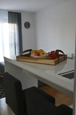 a tray of fruit on a counter in a kitchen at Riverside Nis in Niš