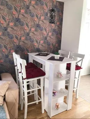 a small white table and two chairs and a table and stool at BlueSky in Vrnjačka Banja