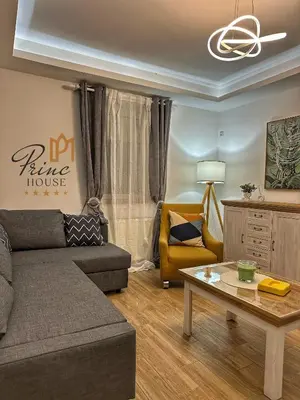 a living room with a couch and a table at Princ house in Leskovac