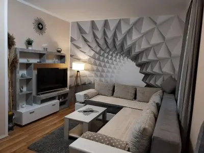 a living room with a couch and a television at Apartman Tina in Soko Banja