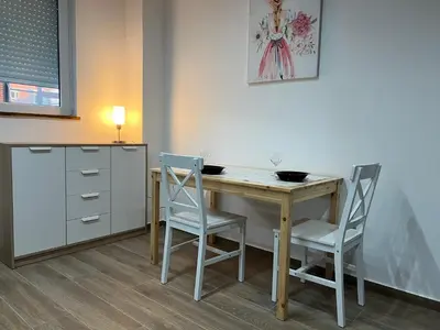 a kitchen with a table and two chairs at LiboroApartments in Niš