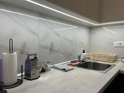 a kitchen with a sink and a coffee maker at LiboroApartments in Niš
