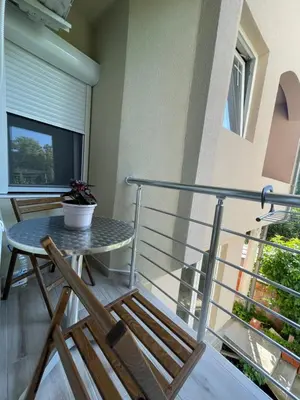 a balcony with a table and chairs at Apartmani Videnovic Sokobanja in Soko Banja