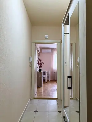 a hallway with a door leading to a dining room at Apartment, Vrnjacka-Banja, Raj in Vrnjačka Banja