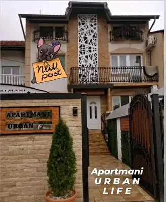 a house with a sign with a dog on it at URBAN Life STYLE in Zaječar