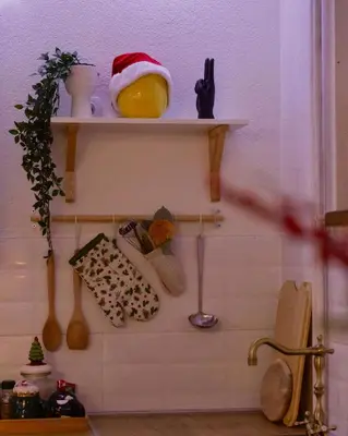 a shelf with a santa hat and some items on it at Villa Buena in Despotovac