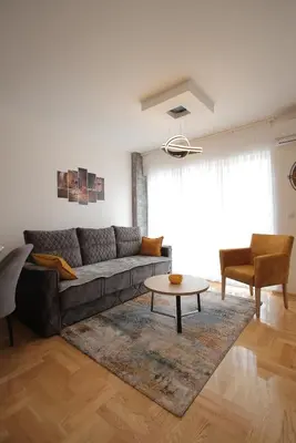 a living room with a couch and a table at Apartman Zivic in Vrnjci
