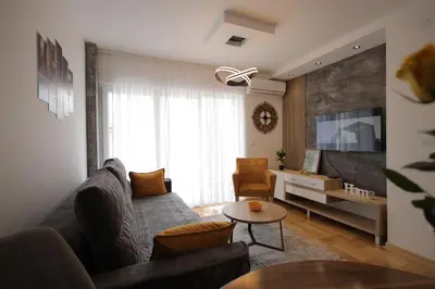 a living room with a couch and a table at Apartman Zivic in Vrnjci