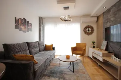 a living room with a couch and a table at Apartman Zivic in Vrnjci