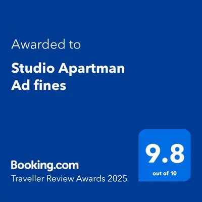a blue screen with the text awarded to studio apartment ad times at Studio Apartman Ad fines in Kuršumlija
