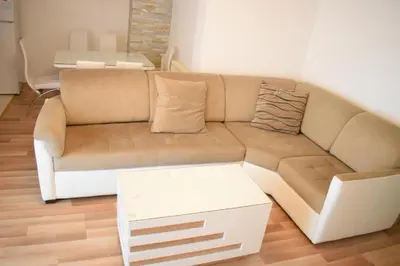 a living room with a couch and a table at Apartman Nina in Vranje