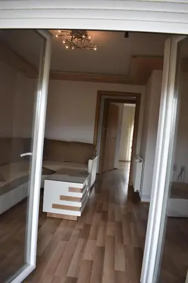 a living room with a couch and a table at Apartman Nina in Vranje