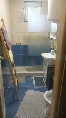 a bathroom with a toilet and a sink at Nena Studio in Jagodina