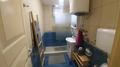a bathroom with a shower and a toilet and a sink at Nena Studio in Jagodina