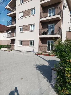 a shadow of a person standing in front of a building at Studio SIESTA in Vrnjačka Banja