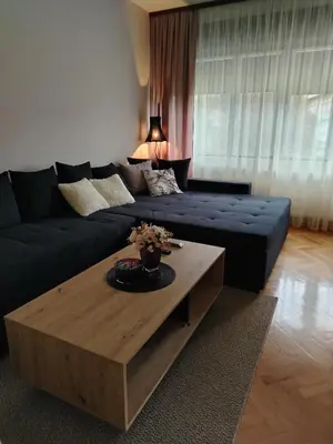 a living room with a couch and a coffee table at Balkan HOME in Kalna