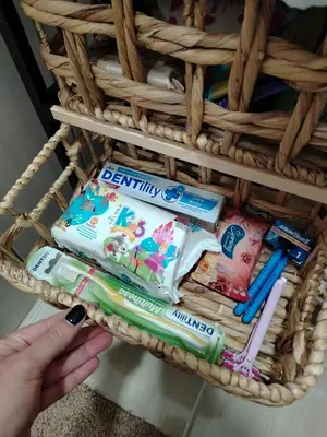 a basket filled with toothbrushes and toothpaste at Balkan HOME in Kalna
