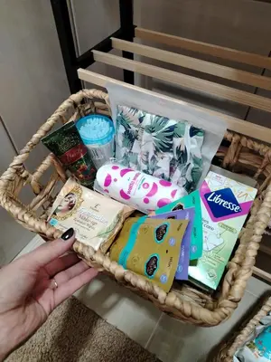 a person holding a basket filled with snacks at Balkan HOME in Kalna