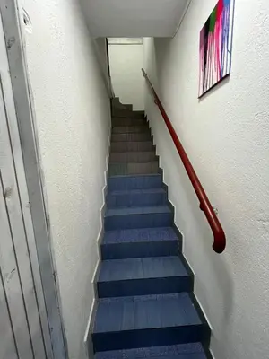 a stairway with blue steps in a building at Stan na dan Raška in Raška
