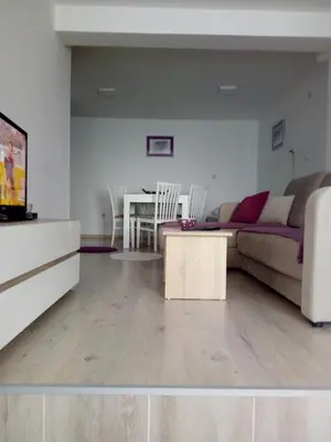 a living room with a couch and a table at Apartments Villa Stars in Kopaonik