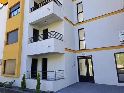 an apartment building with a balcony and a door at Hakuna Matata in Vrnjačka Banja