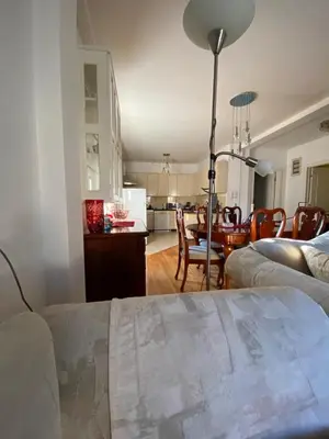 a living room with a kitchen and a dining room at Vila Nada Apartment in Vrnjacka Banja in Vrnjačka Banja