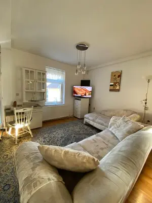 a living room with a couch and a table at Vila Nada Apartment in Vrnjacka Banja in Vrnjačka Banja