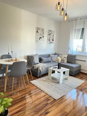 a living room with a couch and a table at Lenka Lux VB in Vrnjačka Banja