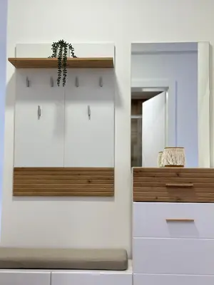 a room with white cabinets and a mirror at Lenka Lux VB in Vrnjačka Banja