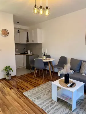 a living room with a couch and a table at Lenka Lux VB in Vrnjačka Banja