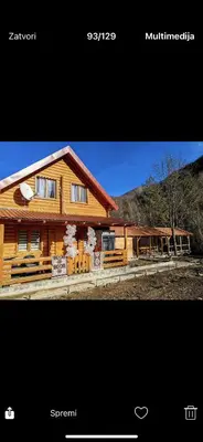 a picture of a log cabin with the words sparrow at Tosic etno kamp in Pirot