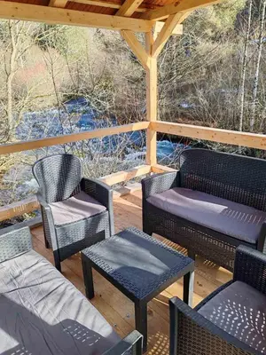 a group of chairs and tables on a patio at Tosic etno kamp in Pirot