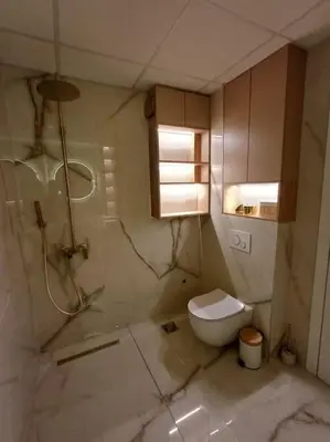 a bathroom with a white toilet and a sink at Mila apartman in Prokuplje