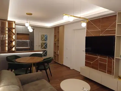 a living room with a couch and a table at Mila apartman in Prokuplje