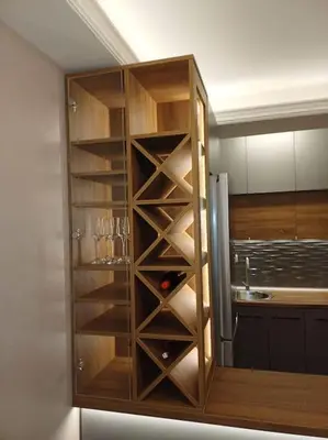 a kitchen with a cabinet with wine glasses in it at Mila apartman in Prokuplje