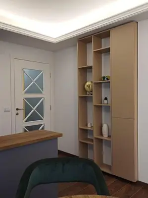 a room with a door and a room with shelves at Mila apartman in Prokuplje