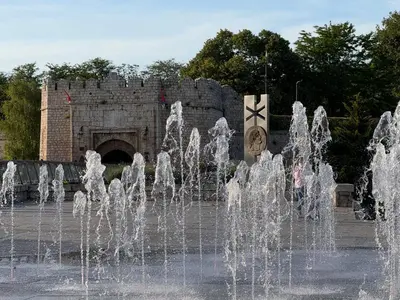 a water fountain in front of a castle at Mint House in Niš