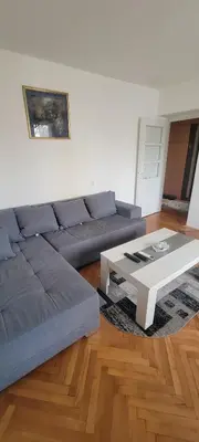 a living room with a couch and a coffee table at Apartman Kraljevo-ceo stan,privatan parking in Kraljevo