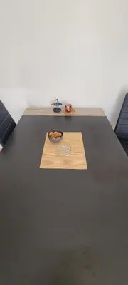 a table with a bowl of food on top of it at Apartman Kraljevo-ceo stan,privatan parking in Kraljevo