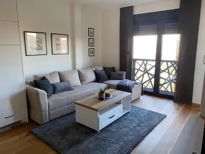 a living room with a couch and a coffee table at Hakuna Matata 2 in Vrnjačka Banja
