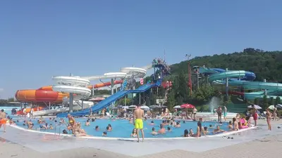 a group of people in a pool at a water park at Jagodina Wing Apartman 2 in Jagodina