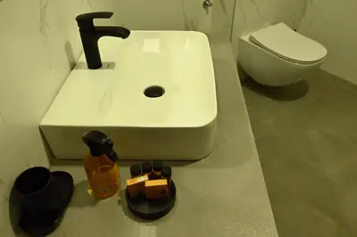 a bathroom with a sink and a toilet at Paradiso in Leskovac