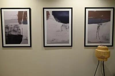 a group of three pictures on a wall at Paradiso 2 in Leskovac