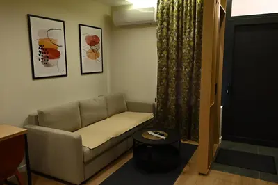 a living room with a couch and a table at Paradiso 3 in Leskovac
