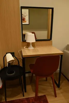 a desk with a lamp and a chair in a room at Paradiso 3 in Leskovac