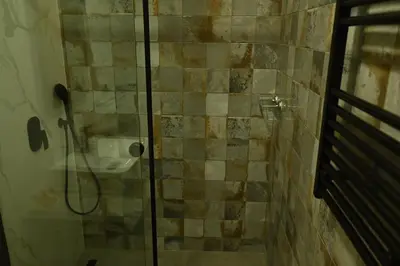 a bathroom with a shower with a sink at Paradiso 3 in Leskovac