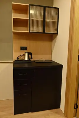 a kitchen with a black counter with a tea kettle on it at Paradiso 3 in Leskovac
