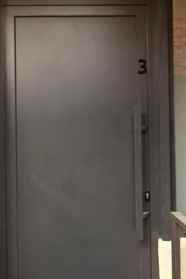 a gray door with the number five on it at Paradiso 3 in Leskovac
